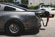 Rear of drag car with parachute and red remove-before-flight tag